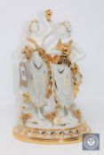 A Capo Di Monte figure with gilt highlights - Grecian style ladies.