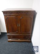 A mahogany television cabinet