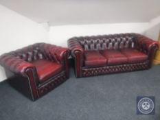 A red buttoned leather Chesterfield three seater settee and matching club armchair