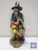 A Royal Doulton figure - The Mask Seller HN 2103