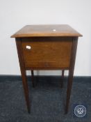 A Victorian inlaid mahogany sewing box