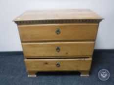 A late 19th century pine three drawer chest