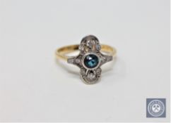 An 18ct gold diamond and blue topaz ring,