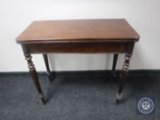 A late 19th century mahogany turnover top tea table