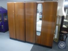 A pair of teak Albro Furniture double door wardrobes