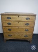 An early 19th century provincial oak four drawer chest