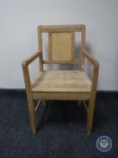 An early 20th century pine child's armchair