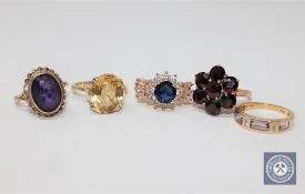 A collection of five yellow metal rings, two hallmarked 9ct, one 14ct.
