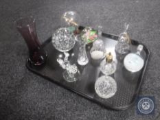 A tray of glass ware, paperweights, hand bells,