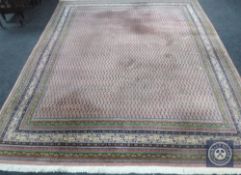 An Eastern carpet on salmon ground,