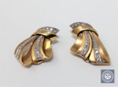 A pair of 18ct gold diamond set clip earrings.