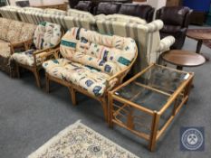 A three piece bamboo conservatory suite comprising of settee,