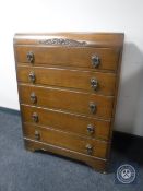 A 20th century oak five drawer chest