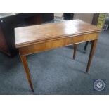 A 19th century mahogany foldover tea table