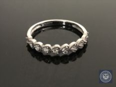 A 9ct white gold diamond set half eternity ring, size N1/2 CONDITION REPORT: 1.