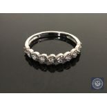 A 9ct white gold diamond set half eternity ring, size N1/2 CONDITION REPORT: 1.