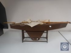 A mid 20th century pond yacht on stand