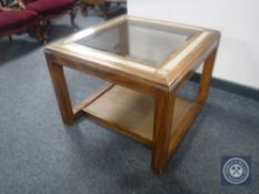 A Colonial style glass topped coffee table