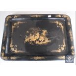 A Chinese lacquered papier mache tray