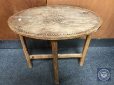 An Edwardian oak Arts and Crafts occasional table