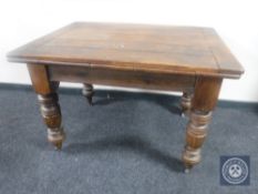 An antique pine drawer leaf table