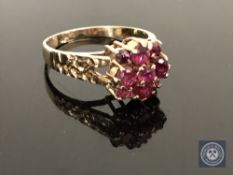 A 9ct gold ruby and diamond cluster ring, size O CONDITION REPORT: 2.