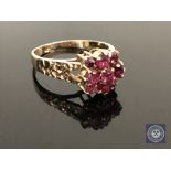 A 9ct gold ruby and diamond cluster ring, size O CONDITION REPORT: 2.