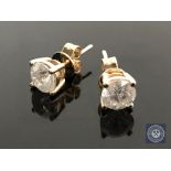 A pair of 14ct yellow gold diamond stud earrings, featuring two round brilliant cut diamonds 1.45ct.