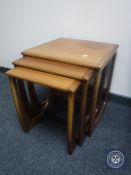 A nest of three teak G Plan tables