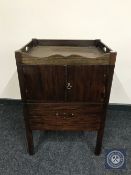 A mahogany double door pot cupboard