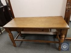 An oak hall table fitted with a drawer,