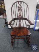 A stained pine Windsor rocking chair