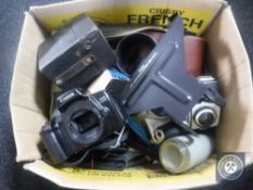 A box of assorted cameras and accessories