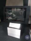 A Bang & Olufsen TV on stand