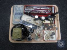 A tray of pair of field glasses, costume jewellery, folded road maps, whistles, coins etc.