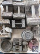 A tray of vintage metal weights