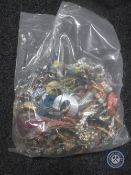 A bag containing a large quantity of costume jewellery