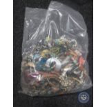 A bag containing a large quantity of costume jewellery