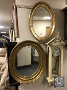 Two ornate oval gilt framed mirrors