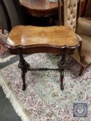 A Victorian figured walnut work table,