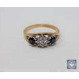 An 18ct gold sapphire and diamond three-stone ring,