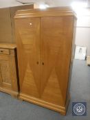 A 20th century continental oak and beech double door cupboard