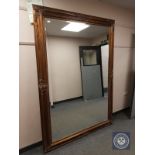 A gilt framed ornate mirror 150 cm x 210 cm