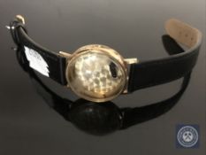 A 9ct gold gent's wristwatch case on black leather strap CONDITION REPORT: The case