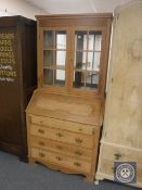 A continental oak bureau bookcase