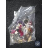 A bag containing a large quantity of costume jewellery