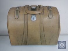 A vintage leather Gladstone bag