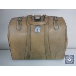 A vintage leather Gladstone bag