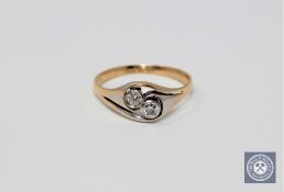 An 18ct gold two-stone diamond ring,