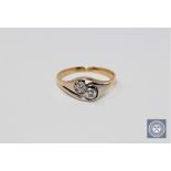 An 18ct gold two-stone diamond ring,